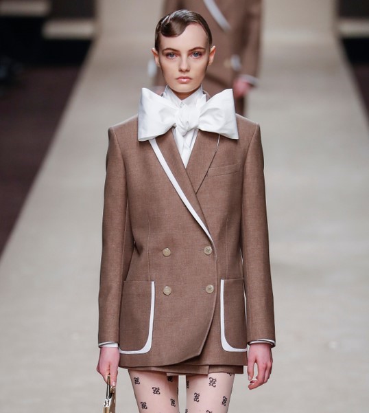 AJU Bow Blog Model with Large Bow at the Neck. Shutterstock.