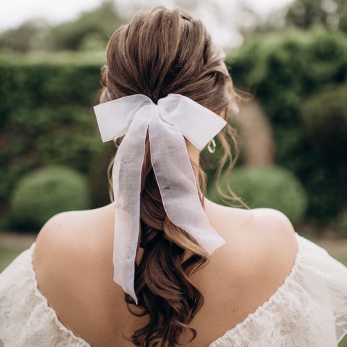 AJU Bow Blog Hairstyle with Bow. Shutterstock.