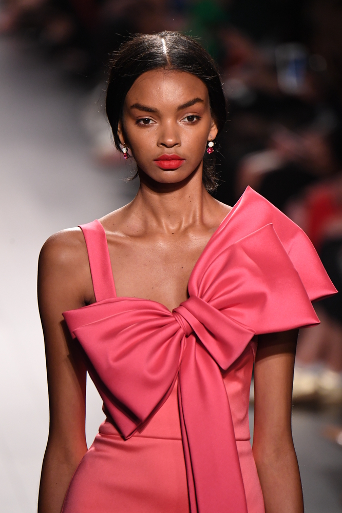 AJU Bow Blog Red Dress with Large Bow. Shutterstock.